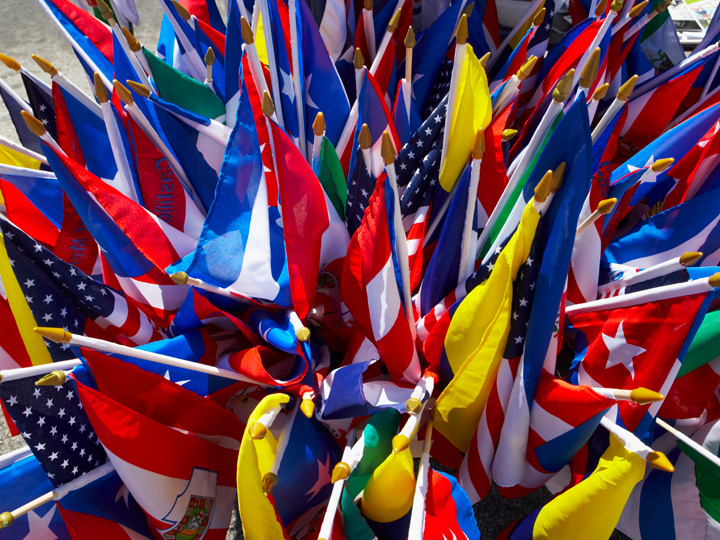 Latin American flags on a stick in a bucket